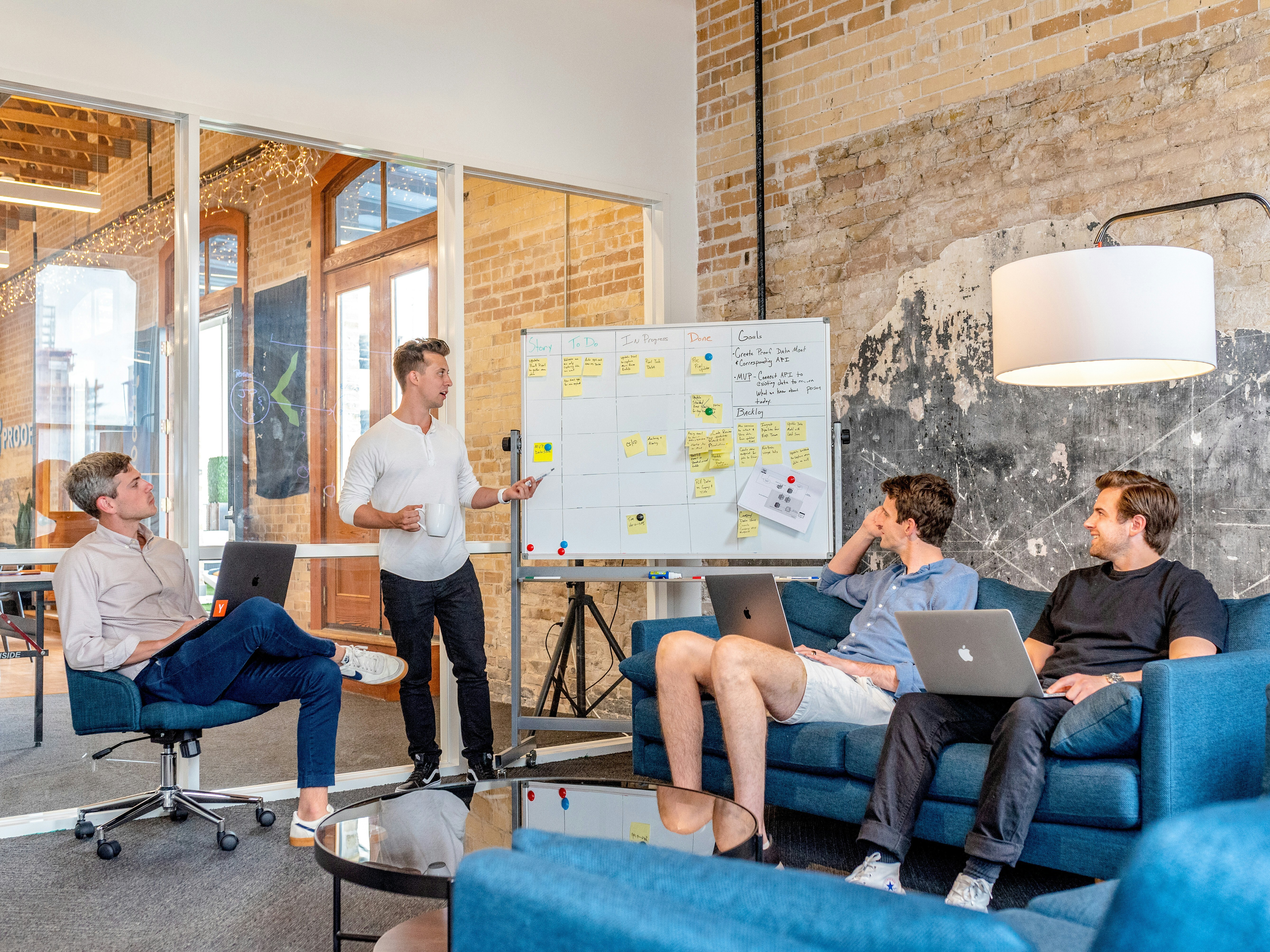 A group of men at a marketing agency talking about content plans.